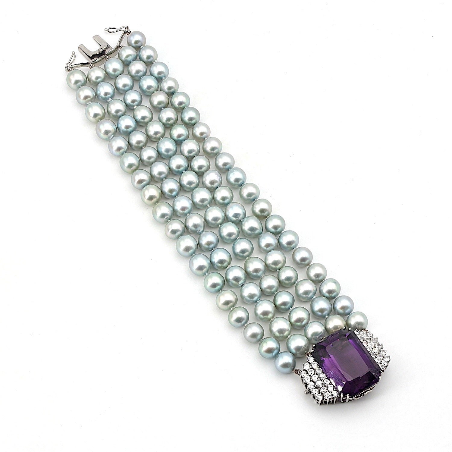 Armband mit 5 Reihen Zuchtperlen und einem Schloss in 750er Weißgold mit Brillanten und einem Amethyst, liegend Draufsicht