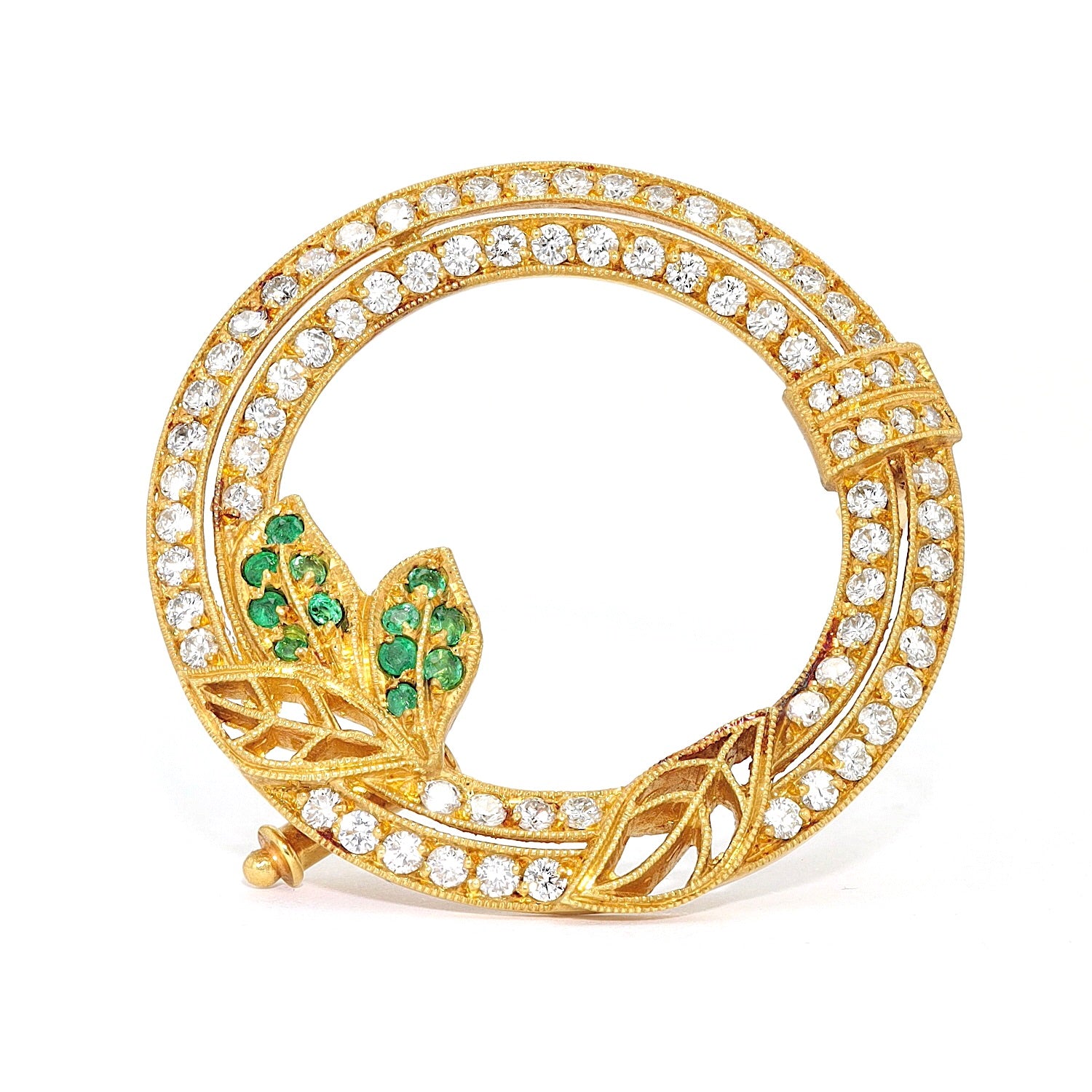 Brosche aus 750er Gelbgold mit Brillanten und Smaragden, stehend frontal