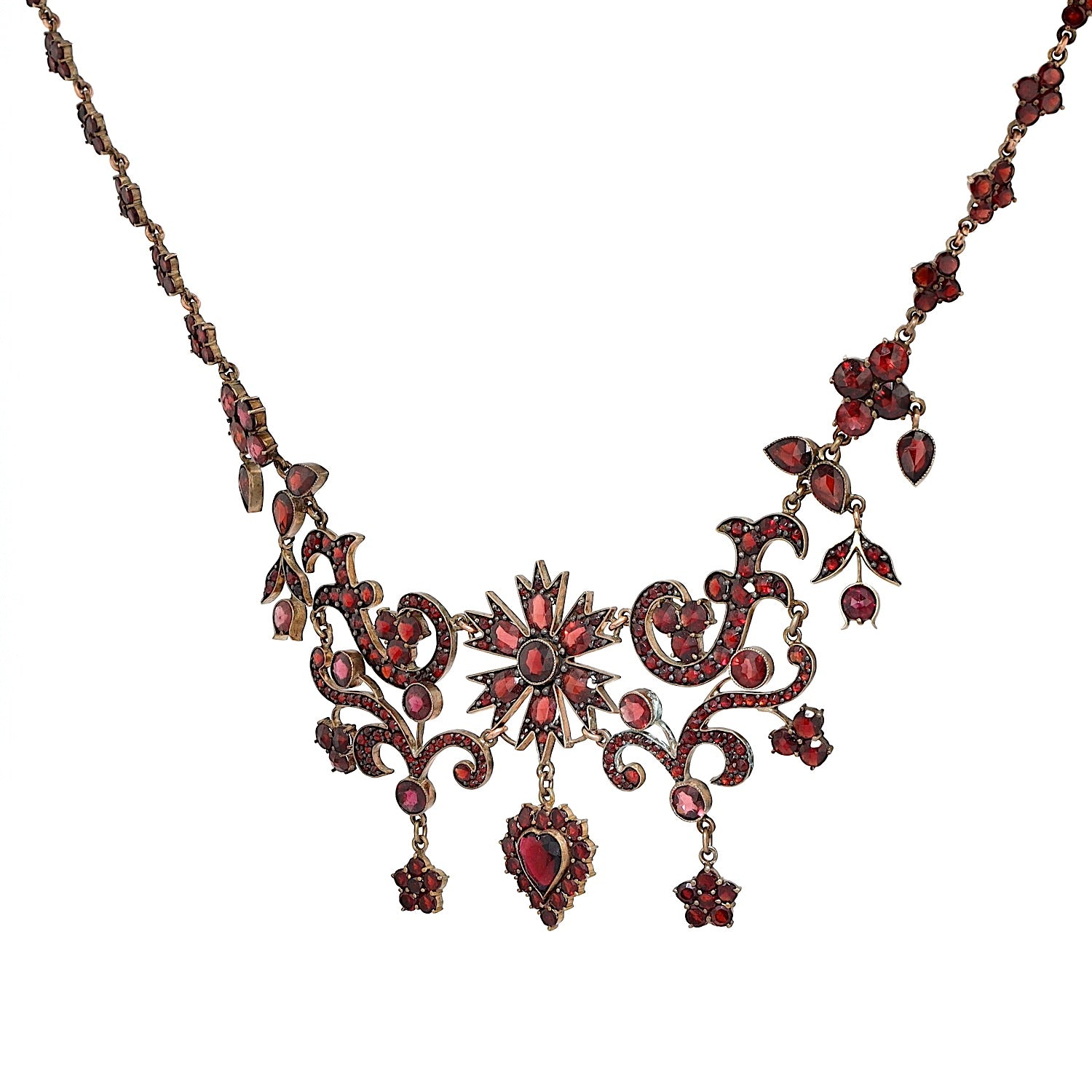 Antikes und ausgefallenes Granatcollier aus Tombak, vergoldet, hängend links gedreht