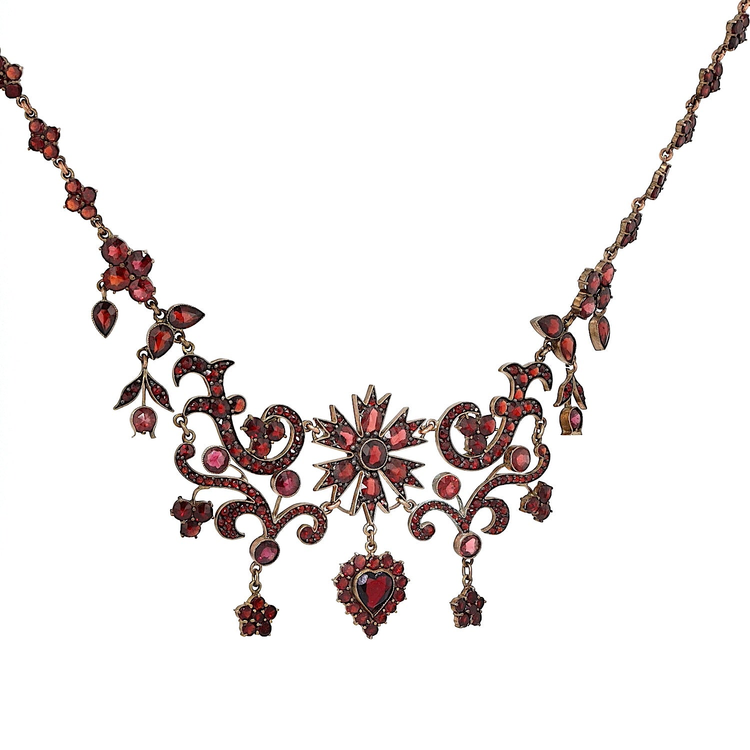 Antikes und ausgefallenes Granatcollier aus Tombak, vergoldet, hängend rechts gedreht