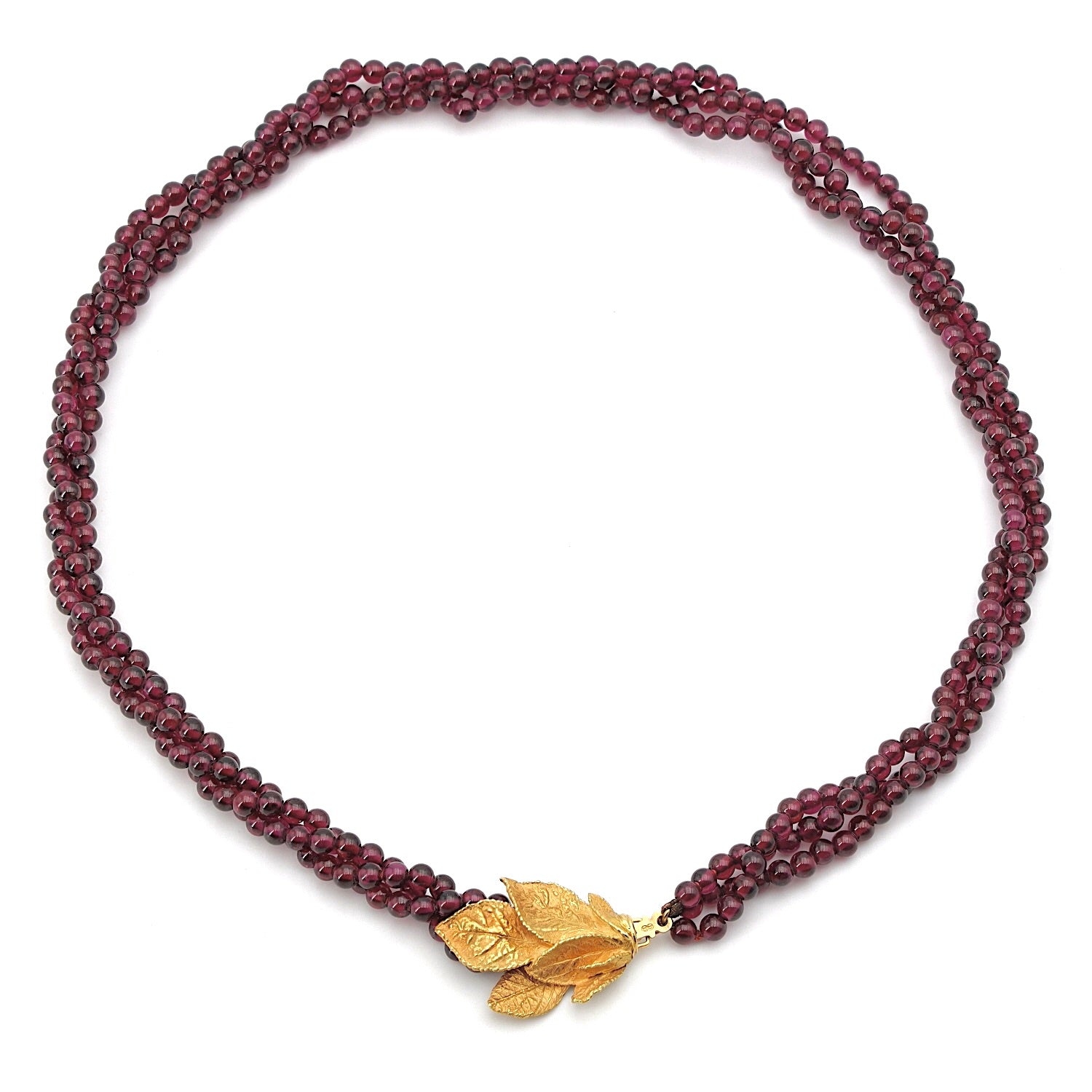 Ehinger Schwarz Collier aus Rhodolith Kugeln und einem Schloss aus 750er Gelbgold, liegend Draufsicht
