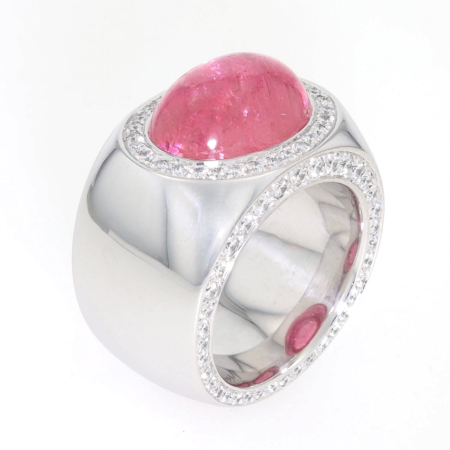 Solid statement ring made from 750 white gold with a pink tourmaline cabochon and brilliants