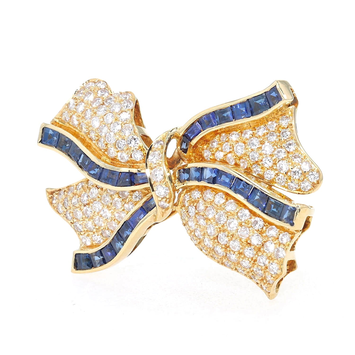 Brosche in 750er Gelbgold mit insgesamt ca. 1 ct Brillanten und blauen Saphiren, stehend inks gedreht