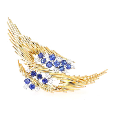 Exclusive Brosche aus 750er Gelbgold mit Brillanten und Saphiren, stehend frontal Saphire unten