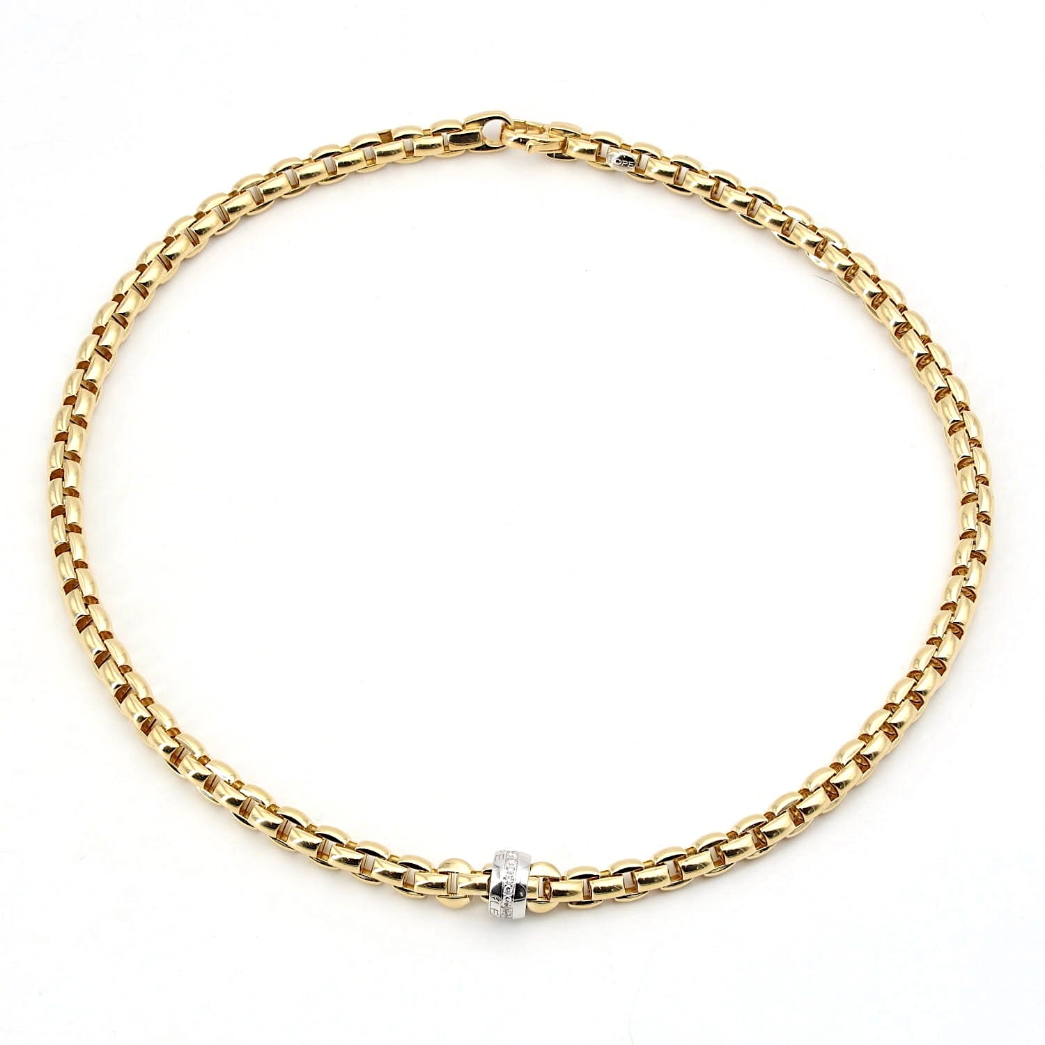 Fope Eka Flex`it Kette in 750er Gelbgold mit einer Ronde in Weißgold mit Brillanten, liegend geschlossen
