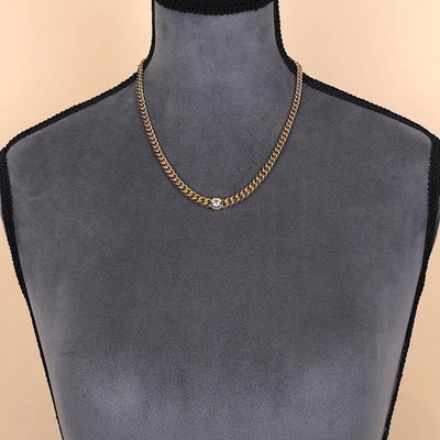 Schwere Kette in 750er Gelbgold mit einem Brillanten ca. 1,25 ct, an einer dunklen Büste